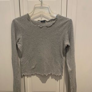 GREY LONG SLEEVE BRANDY MELVILLE TOP. FRILLED AROUND NECKLINE AND SLEEVES